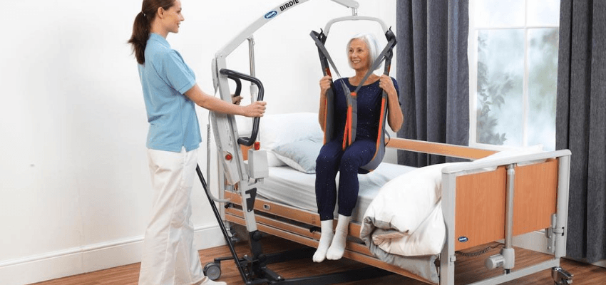 Carer uses Birdie hoist with patient, Purpl discounts for disabilities and long term health conditions, mobility discounts and offers.