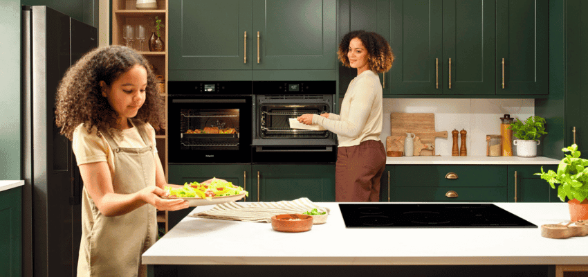 Hotpoint kitchen scene with family cooking Purpl disabled discounts members save on home appliances and oven deals