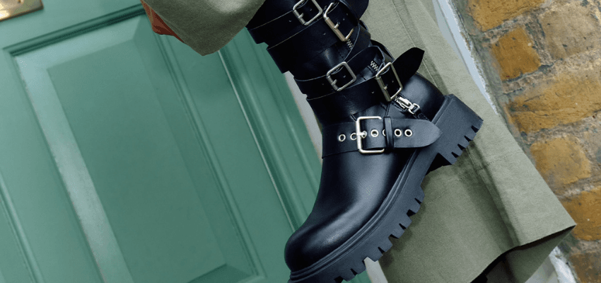 Black buckled boot by green door, schuh Purpl discounts for disabilities and long term health conditions, mobility discounts and offers.