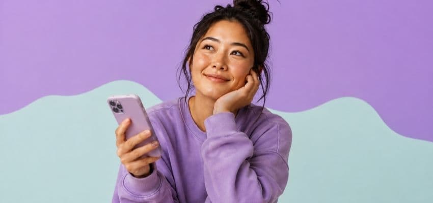 Woman holding smartphone against purple background; Purpl discounts for disabilities and long term health conditions, shopping discounts for disabled people.