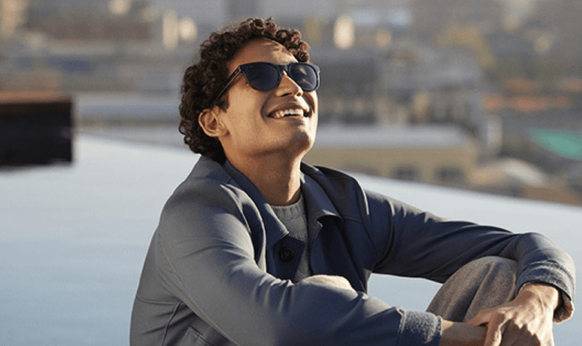 Man enjoying the sunshine wearing sunglasses from Vision Express, with exclusive disabled discounts on prescription sunglasses and eye care essentials in the UK.