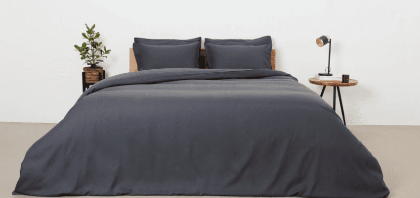 Dark grey bed with pillows, Panda Purpl discounts for disabilities and long term health conditions, shopping discounts for disabled people.