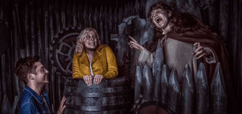 The York Dungeon disability discount with Purpl discounts, visitors in dark medieval themed attraction scene.