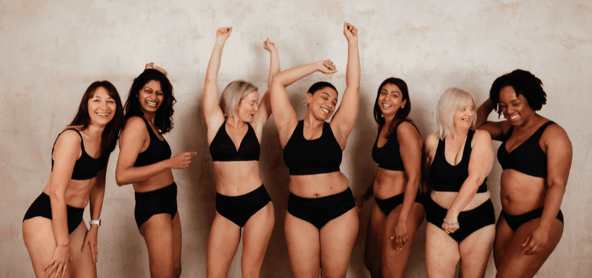 Smiling women in black underwear posing together, Purpl discounts for disabilities and long term health conditions, mobility discounts and offers.