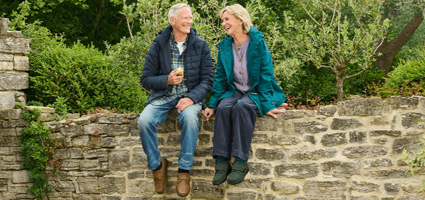 Older couple on garden wall, Cosyfeet: Purpl discounts for disabilities and long term health conditions, mobility discounts and offers.