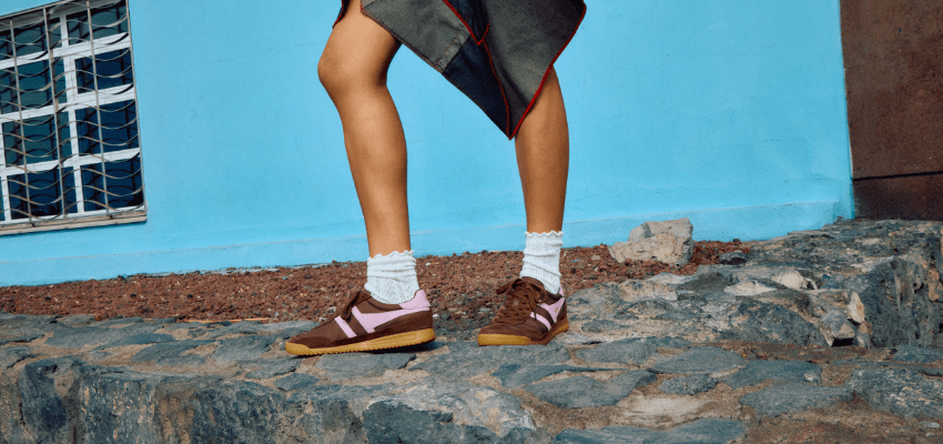 Person wearing brown and pink trainers from Schuh, Purpl discounts for disabilities and long term health conditions, mobility discounts and offers.