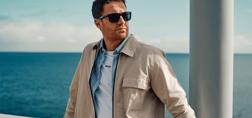 Man in sunglasses by the sea, Mainline Purpl discounts for disabilities and long term health conditions, shopping discounts for disabled people.