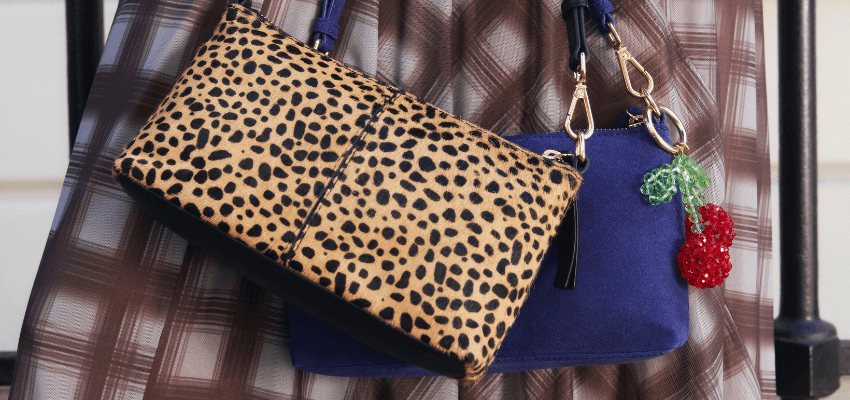 Leopard-print clutch and blue handbag display, Accessorize Purpl discounts for disabilities and long term health conditions, mobility discounts and offers.