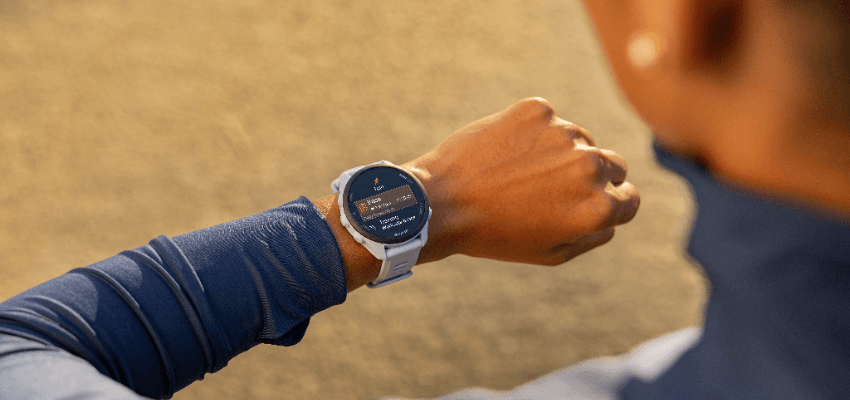 Person checking Garmin smartwatch with fitness data, Purpl discounts for disabilities and long term health conditions, mobility discounts and offers.