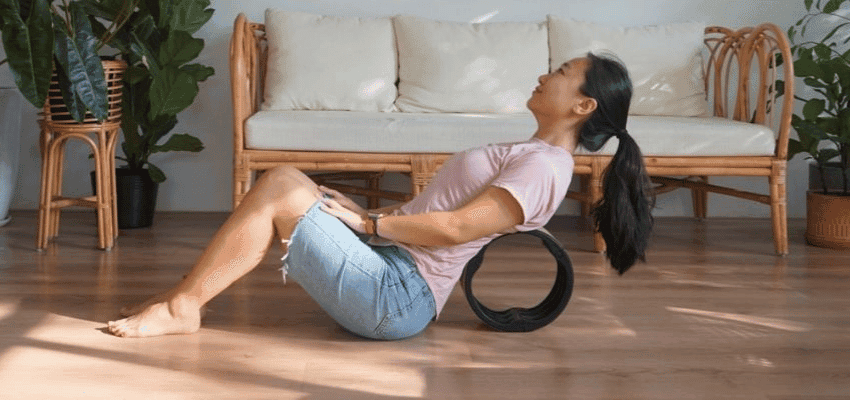 Woman using a back roller at home; Purpl discounts for disabilities and long term health conditions, mobility discounts and offers.
