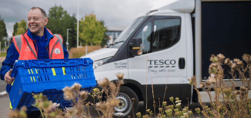 Tesco delivery driver carrying a blue crate; Purpl discounts for disabilities and long term health conditions, mobility discounts and offers.