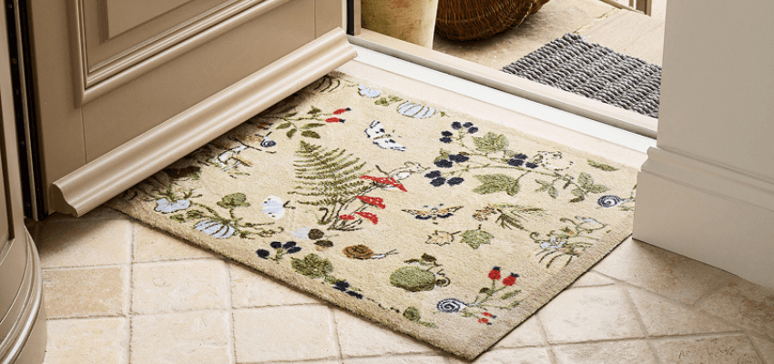 Floral doormat at an open doorway, with Purpl discounts for disabilities and long term health conditions and mobility discounts and offers.