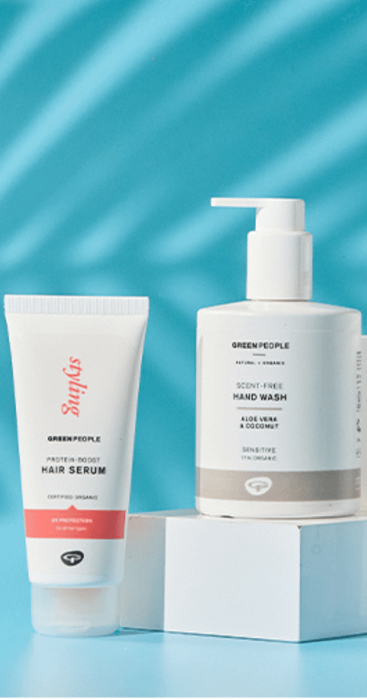 A range of Green People organic skincare and personal care products, including hair serum, hand wash, and baby nappy cream, set against a blue background. Showcasing Purpl's exclusive discounts for organic and eco-friendly skincare for disabled individuals in the UK.