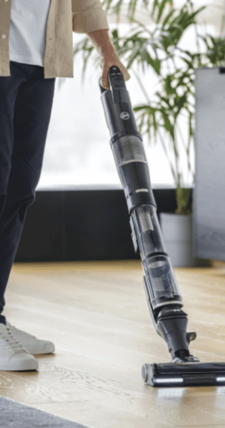 man hoovering