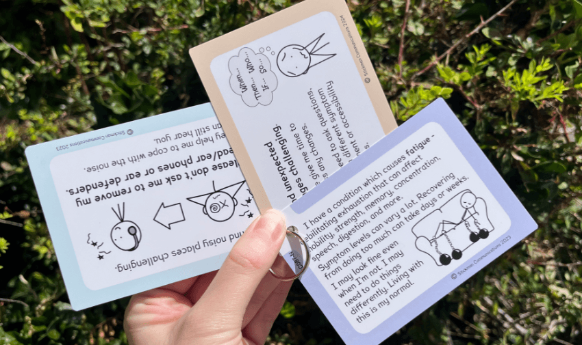 Stickman Communications: A hand holds three communication cards with stick-figure illustrations and text about managing sensory challenges, unexpected changes, and chronic fatigue, highlighting exclusive disabled member deals.