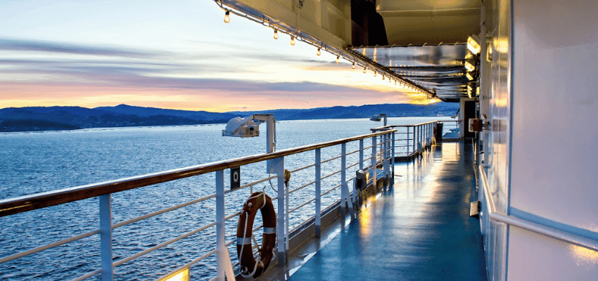 Ferry deck at sunset over calm sea, Direct Ferries Purpl discounts for disabilities and long term health conditions, disabled travel discounts UK.