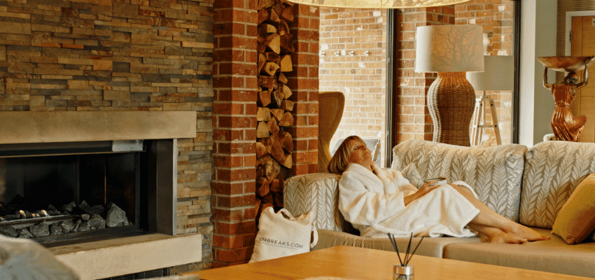 Woman relaxing on sofa at Spabreaks.com, Purpl discounts for disabilities and long term health conditions, disabled travel discounts UK.