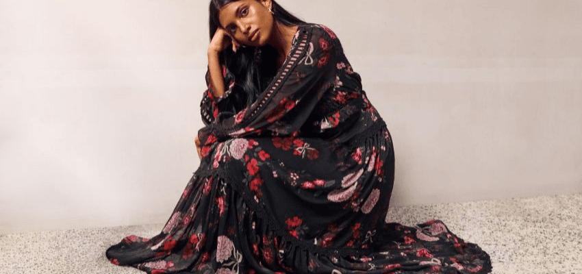 Woman in a floral maxi dress showcasing Simply Be fashion discounts, with offers tailored for plus size and disabled shopping discounts UK.