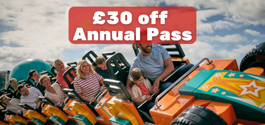 Family enjoying colourful rollercoaster ride at Legoland with £30 off annual pass offer, Disabled Travel Discounts UK and Family Theme Park Deals.
