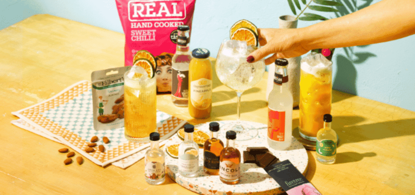 Assorted drinks and snacks on table, The Curious Drinker, Purpl discounts for disabilities and long term health conditions, shopping discounts for disabled people.