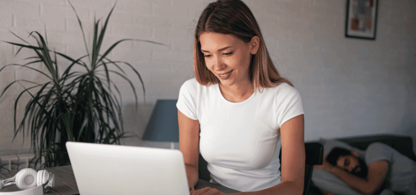 Woman using her laptop to access Harley Street ADHD online support and mental health services.