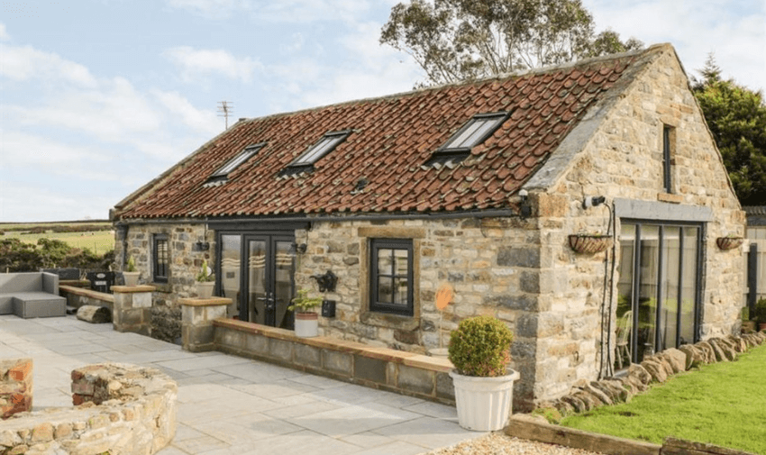 Stone-built cottage with modern features, ideal for accessible getaways. Sykes Cottages offers inclusive holiday options. Disabled travel discounts UK, holiday discounts for disabled people
