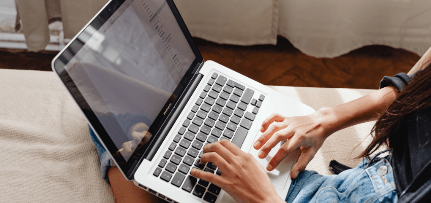 Person using laptop at home for eBay Purpl discounts for disabilities and long term health conditions, shopping discounts for disabled people.
