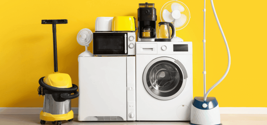 Household appliances including a washing machine microwave vacuum and fans against a yellow wall Purpl discounts shopping discounts for disabled people accessibility discounts UK mobility discounts and offers savings for people with long term health conditions cost of living help for disabled people