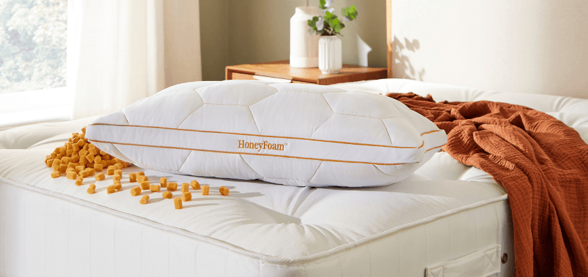 Pillow on bed in The Fine Bedding Company, Purpl discounts for disabilities and long term health conditions, mobility discounts and offers.