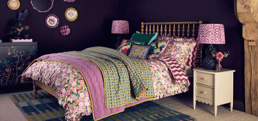 Colourful floral bedroom with patterned bedding at Dunelm, Purpl discounts for disabilities and long term health conditions, mobility discounts and offers.