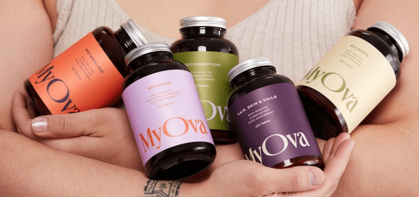 Person holding MyOva supplement bottles, Purpl discounts for disabilities and long term health conditions, shopping discounts for disabled people.