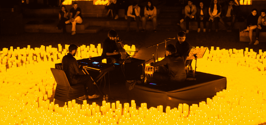 Candlelit live music performance on a floating stage at Fever, Purpl discounts for disabilities and long term health conditions, mobility discounts and offers.