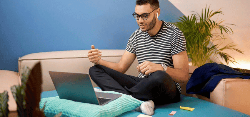 Man using laptop at home, Virgin Media Purpl discounts for disabilities and long term health conditions, shopping discounts for disabled people.