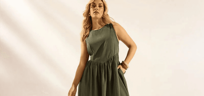 Woman in green dress, Yours Clothing Purpl discounts for disabilities and long term health conditions, shopping discounts for disabled people.