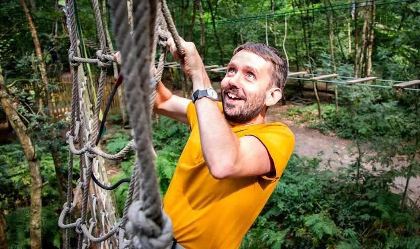 Man climbing rope course at Go Ape, Purpl discounts for disabilities and long term health conditions, disabled travel discounts UK.