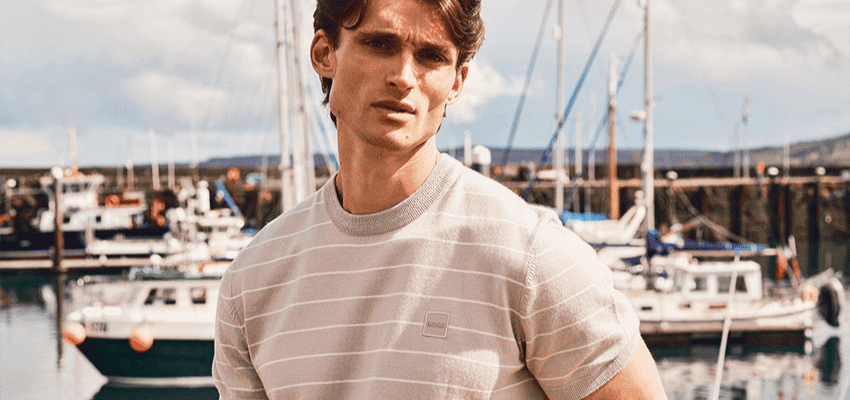 Man standing by boats at marina, Mainline Purpl discounts for disabilities and long term health conditions, mobility discounts and offers.