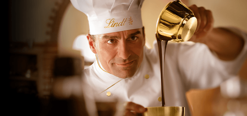 Chocolatier pouring melted chocolate at Lindt, Purpl discounts for disabilities and long term health conditions, mobility discounts and offers.