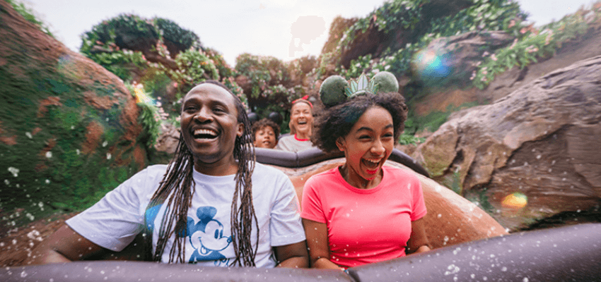 Families laughing on a water ride, Walt Disney Travel Company Purpl discounts for disabilities and long term health conditions, mobility discounts and offers.
