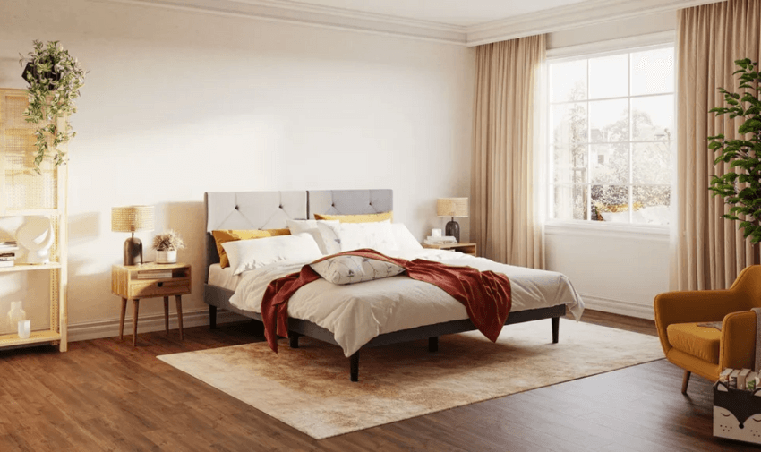 Modern bedroom with gray bed, white bedding, mustard accents, and natural light