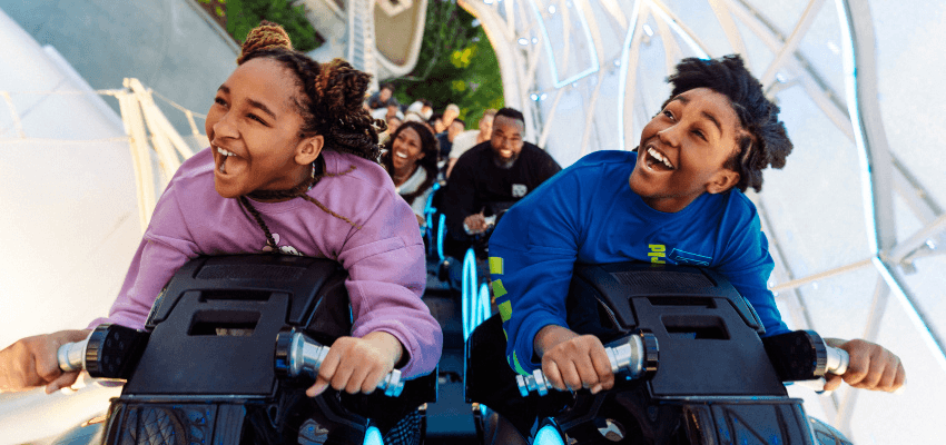 Families enjoying an accessible theme park ride, Walt Disney Travel Company Purpl discounts for disabilities and long term health conditions, disabled travel discounts UK.