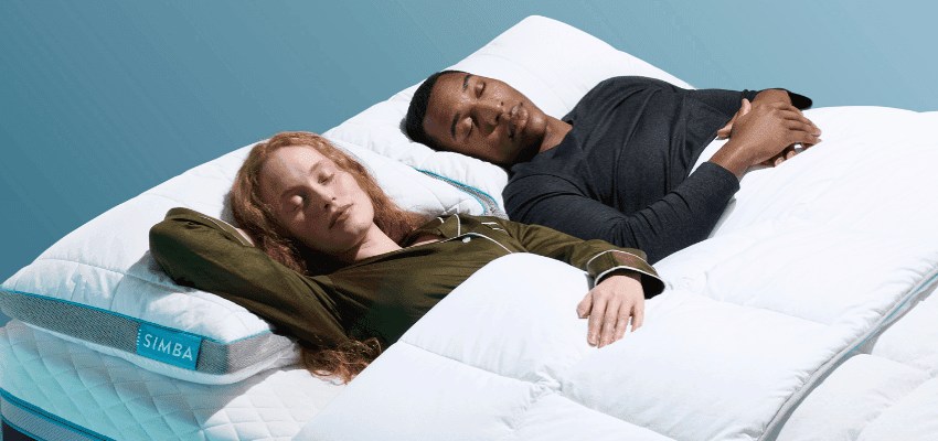 Couple sleeping on a white mattress, Simba Sleep Purpl discounts for disabilities and long term health conditions, shopping discounts for disabled people.