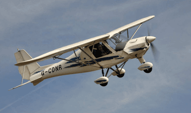 Image of a small aircraft flying