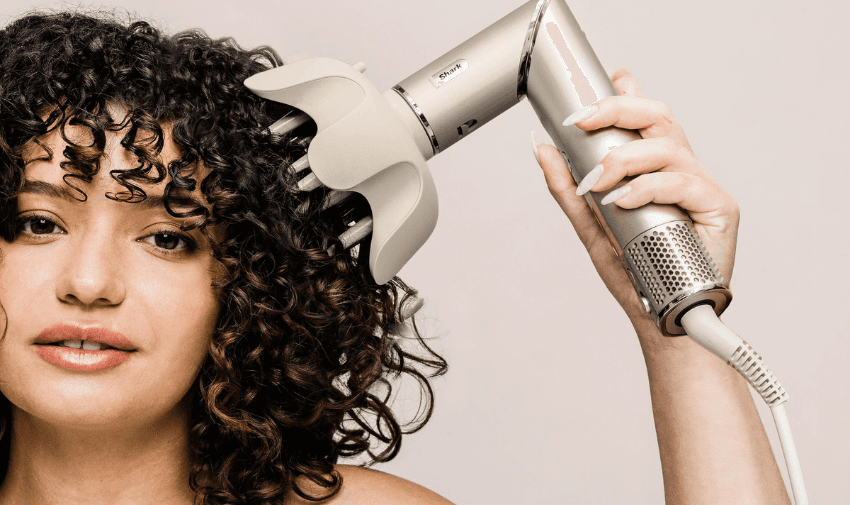 A lady using a Shark UK hairdryer