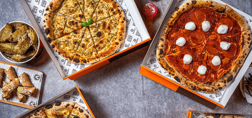 Pizzas and sides in takeaway boxes, Fireaway Pizza Purpl discounts for disabilities and long term health conditions, including mobility discounts and offers.