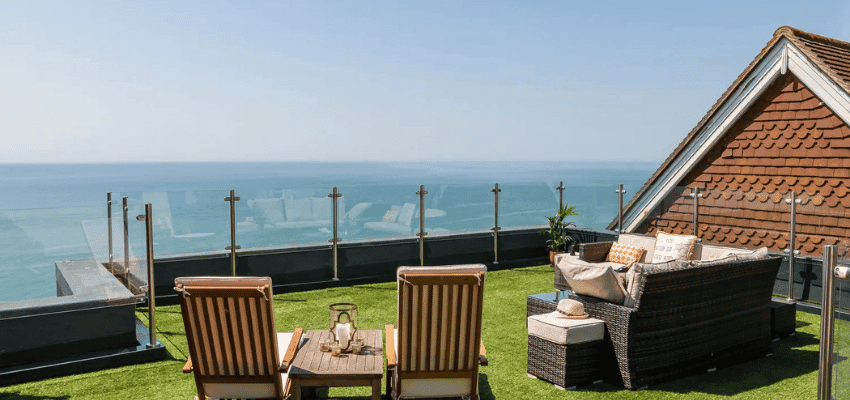 Seaside rooftop terrace with loungers, Sykes Cottages, Purpl discounts for disabilities and long term health conditions, disabled travel discounts UK.