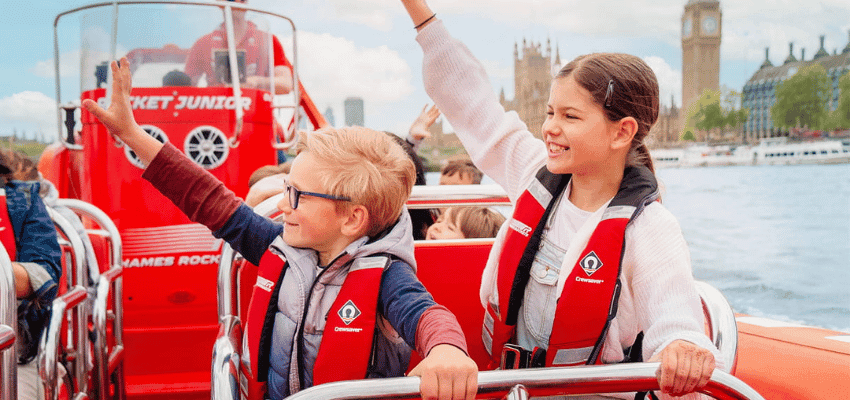 Children waving on a speedboat in London, Buyagift Purpl discounts for disabilities and long term health conditions, disabled travel discounts UK.