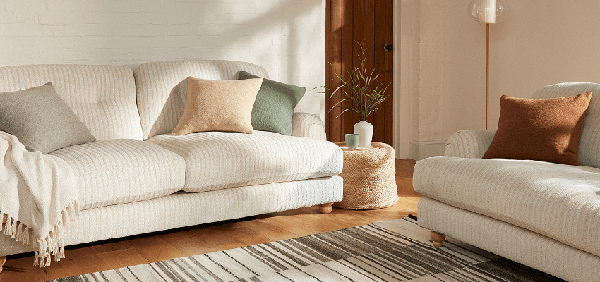 Cream sofas in a bright lounge, Dunelm Purpl discounts for disabilities and long term health conditions, shopping discounts for disabled people.