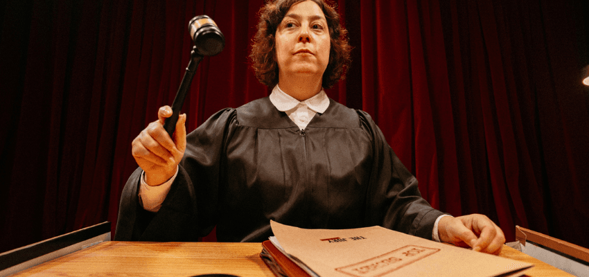 Judge holding gavel at courtroom bench, Fever Purpl discounts for disabilities and long term health conditions, mobility discounts and offers.