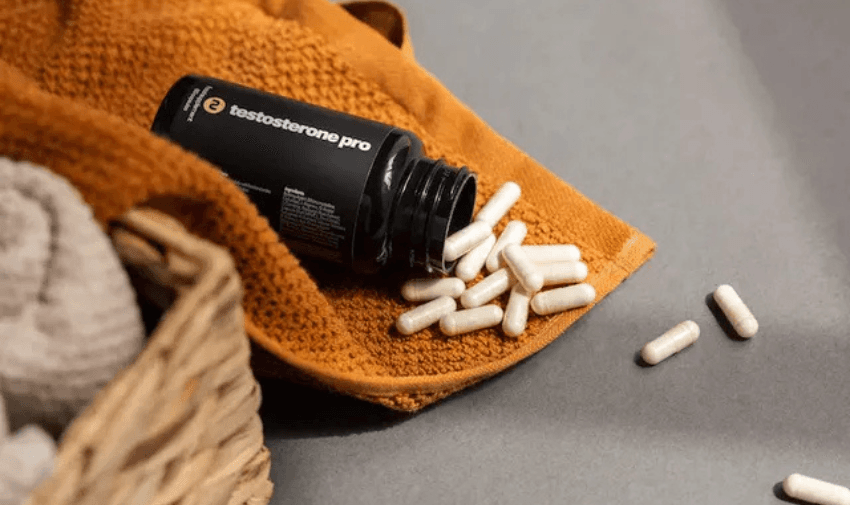 Open bottle of testosterone supplements on towel – Save on men’s health and vitality treatments with Purpl inclusive pricing.