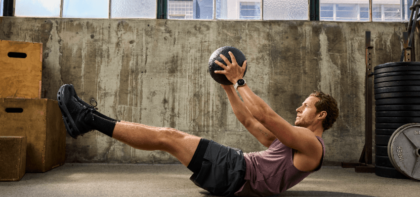 Man doing a weighted core exercise with Garmin Purpl discounts for disabilities and long term health conditions, mobility discounts and offers.